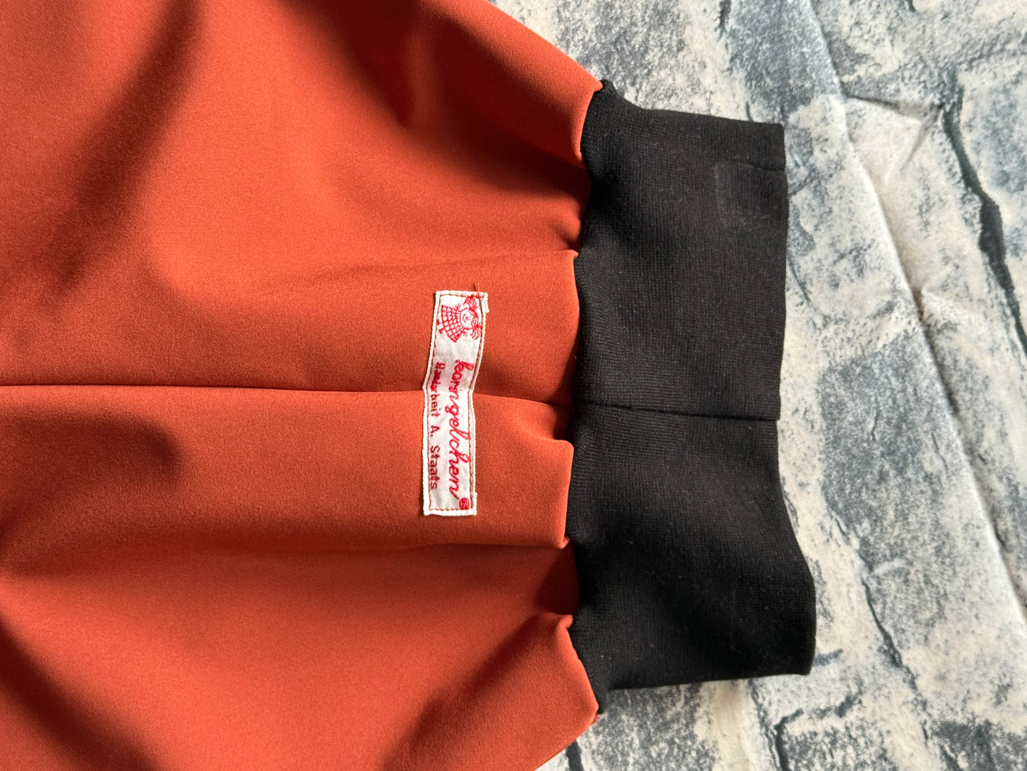 Softshell-Regenhose für Kinder – Rost mit schwarzen Bündchen